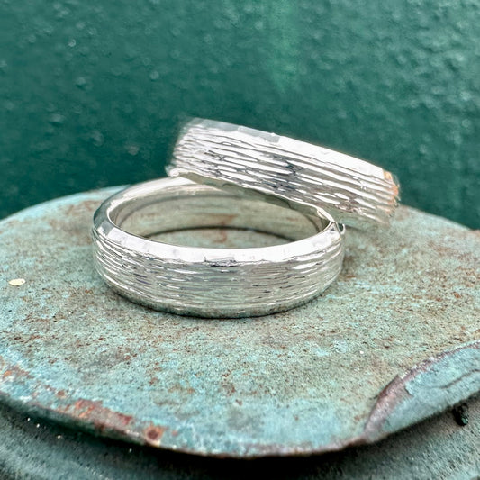 Travis and Travis' Wedding Bands