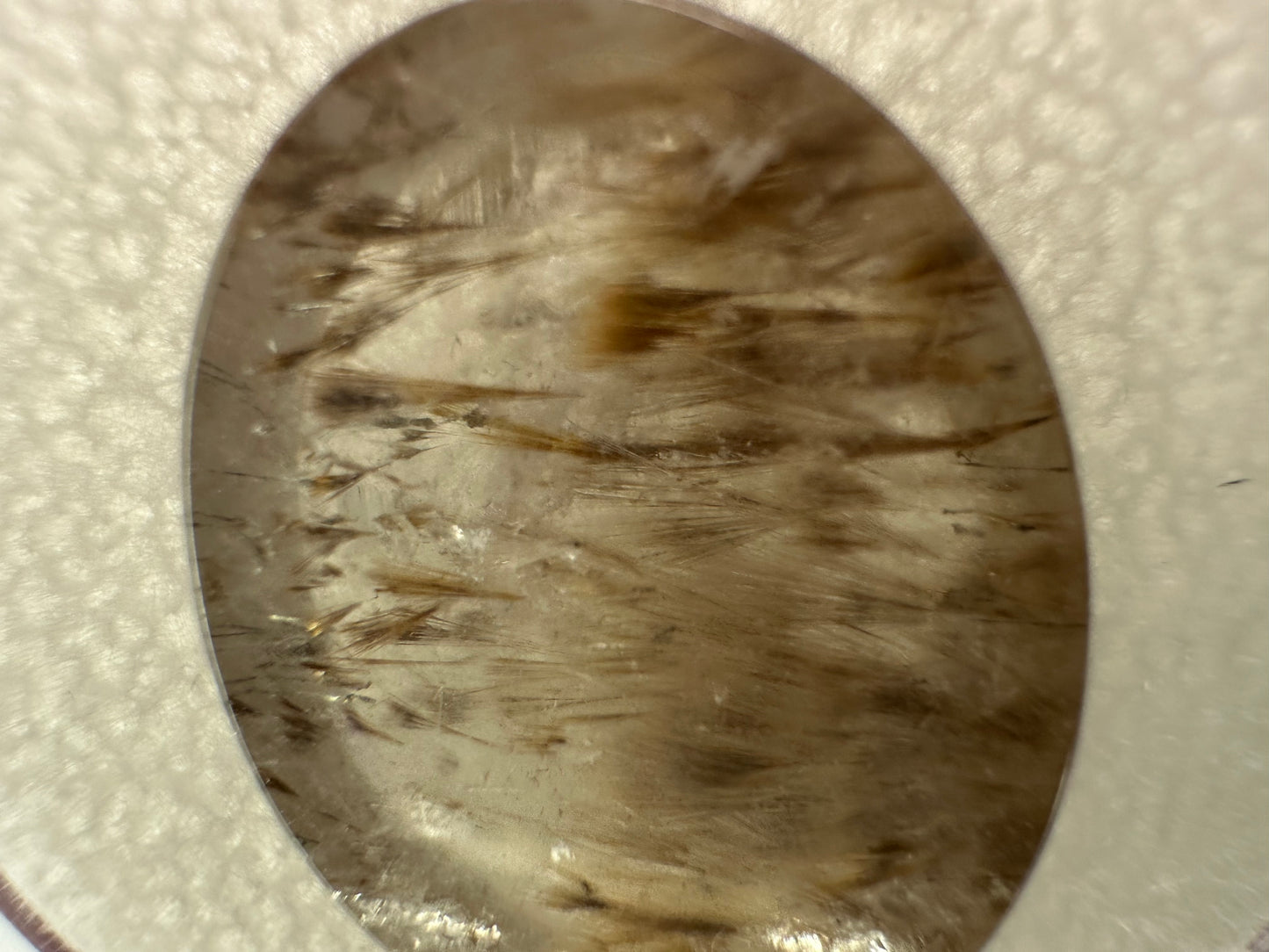 Cocoxenite in Quartz Oval Gem